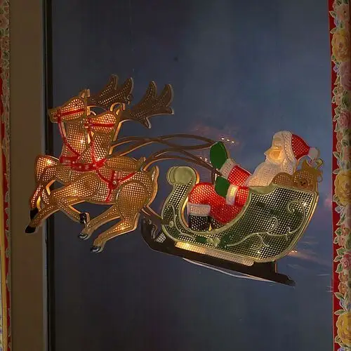 Konstsmide Christmas Renifer z Mikołajem – obraz LED na okno